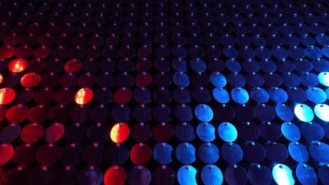 Red and blue sequins sparkling reflective background. Abstract kinetic glitter wall moving. Night club decoration. Can be used as transitions, added to modern projects,art backgrounds.