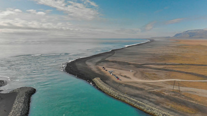 Jokullsarlon glacial lake in southwest Iceland. Panoramic aerial view of icebergs on the beach
