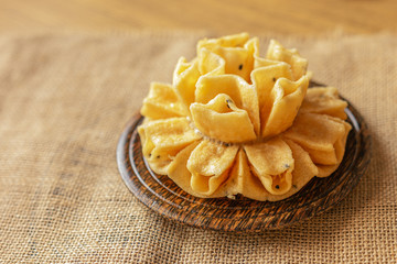 Crispy lotus blossom cookies isolated on white. Thai traditional snack. Top view. Thai homemade cookies.