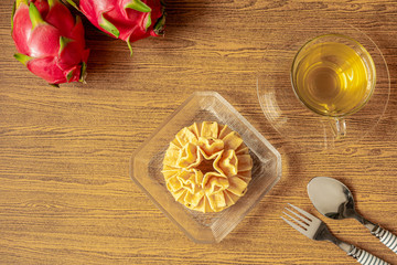 Crispy lotus blossom cookie or Dok Jog on the wooden table background of Thai desserts. Thai traditional snack.