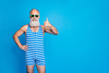 Portrait of his he nice attractive funky content cheerful cheery glad gray-haired man showing thumbup ad advert chill out isolated over bright vivid shine turquoise blue background