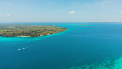 Naklejka na ściany i meble Tropical islands with coral reefs in the blue water of the sea, aerial view. Balabac, Palawan, Philippines. Summer and travel vacation concept.
