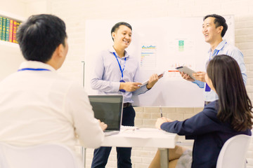Obraz premium Team of employee present project to the employer in modern office.