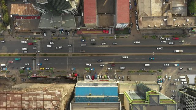 Abstract overhead aerial view of traffic driving navigating through busy street during evening rush hour in Addis Ababa, Ethiopia