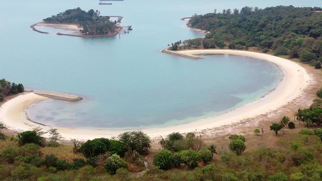 Aerial, drone shot, of the Lazarus island beach, on a sunny day, at the Singapore strait, Asia