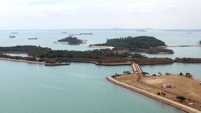 Aerial, drone shot, towards the Lazarus and Seringat islands, on a sunny day, at a coast of Singapore, Asia