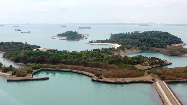 Aerial, drone shot, overlooking the Lazarus and Seringat islands, on a sunny day, at a coast of Singapore, Asia