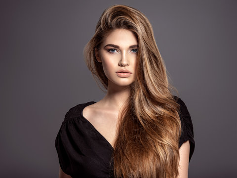 Woman With Beauty Long Brown Hair. Fashion Model. Pretty Face.