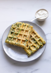spinach waffles on white marble background with opy space