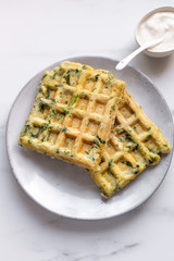 spinach waffles on white marble background with opy space