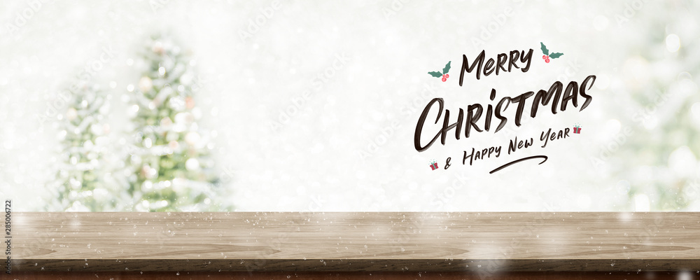 Poster merry christmas and happy new year wreath with golden glitter texture over wood table top at blur bo
