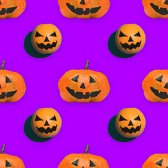 seamless pattern of pumpkins on Halloween on purple background