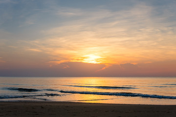 Fototapeta na wymiar Sunrise on the sea beach