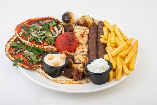 Lebanese Mixed Grill plate isolated on white.