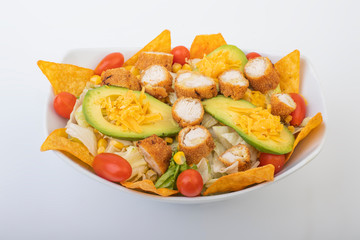 Crunchy Chicken Avocado Salad isolated on white background