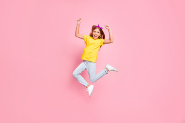 Full length body size view of her she nice attractive lovely ecstatic cheerful cheery pre-teen girl wearing yellow t-shirt having fun free time rejoicing isolated over pink pastel background