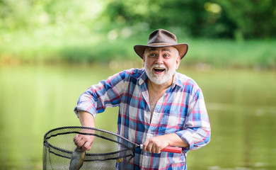 i am retired. summer weekend. fisherman with fishing rod. pothunter. man catching fish. retired...