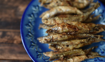fried fish with crispy crust on a blue plate