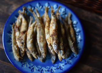 fried fish with crispy crust on a blue plate