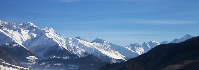 View on snowy mountains and beautiful blue sky in nice sunny morning