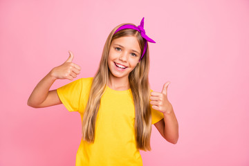 Obraz na płótnie Canvas Photo of kind nice cute friendly girl showing you thumb up to give you nice feedback while isolated with pink background