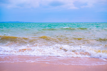 Summer vacation view of the blue sky with beautiful sea. wave ocean on sandy beach. for travel in the holidays. nature background.