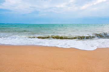 Fototapeta premium Summer vacation view of the blue sky with beautiful sea. wave ocean on sandy beach. for travel in the holidays. nature background.