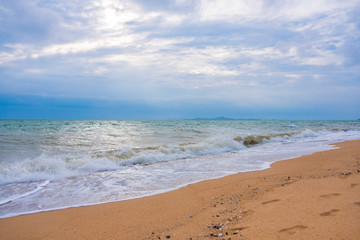 Summer vacation view of the blue sky with beautiful sea. wave ocean on sandy beach. for travel in the holidays. nature background.