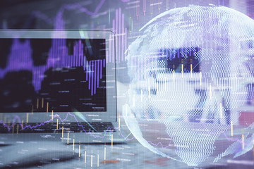 Financial graph colorful drawing and table with computer on background. Double exposure. Concept of international markets.