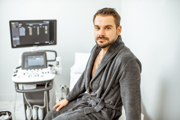 Man at the medical office with ultarsound diagnostics