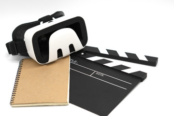 Movie clapper board, notebook and  virtual reality glasses on white background. Concept of...