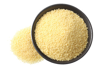 Couscous in black bowl isolated on white background. top view