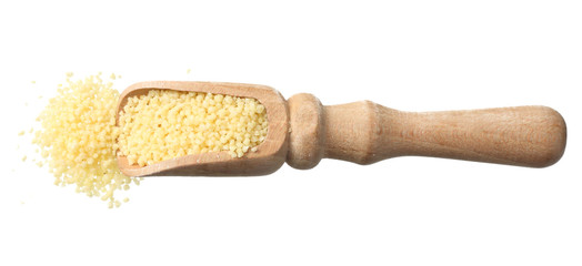 Couscous in wooden spoon isolated on white background. top view