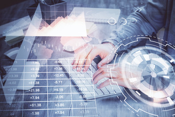 Double exposure of financial graph with man works in office on background. Concept of analysis.