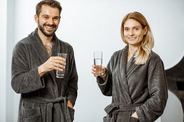 Man and woman with mineral water at the pump-room