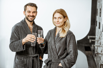 Man and woman with mineral water at the pump-room