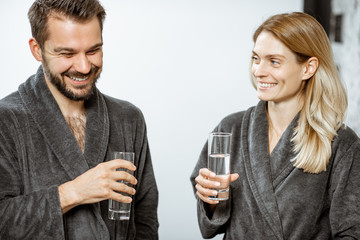 Man and woman with mineral water at the pump-room