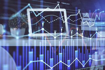 Stock market graph and table with computer background. Multi exposure. Concept of financial analysis.