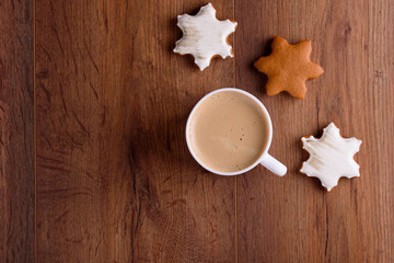Homemade Christmas cookies with spices, and coffee with milk