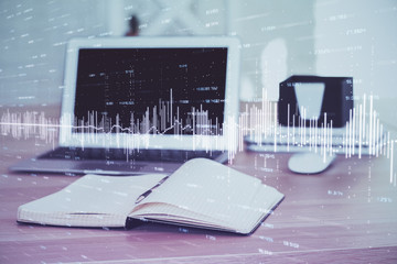 Forex market chart hologram and personal computer background. Double exposure. Concept of investment.