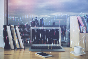 Financial graph colorful drawing and table with computer on background. Double exposure. Concept of international markets.