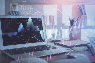 Forex market chart hologram and personal computer background. Multi exposure. Concept of investment.