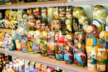 Fototapeta premium Detail of some souvenirs from Russia, found in a outdoor market in Saint Petersburg. There are colorful matryoshkas, plates and eggs