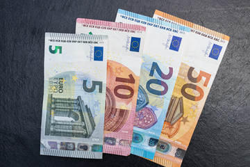 Euro currency cash bank notes money dark background