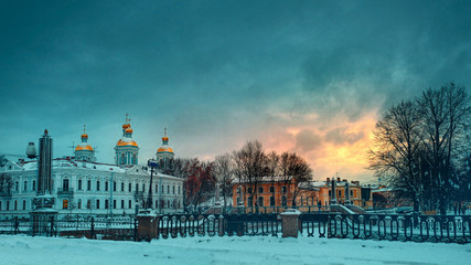 City landscape. St. Nicholas Naval Cathedral in St. Petersburg, Winter sunset in the Seven Bridges...