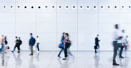 blurred business people at a trade fair