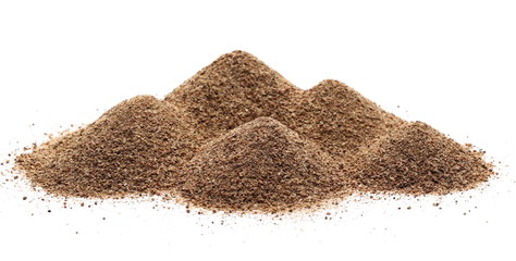 Ground carob powder (Ceratonia siliqua) isolated on white background
