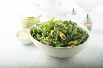 Pasta salad with pesto and arugula