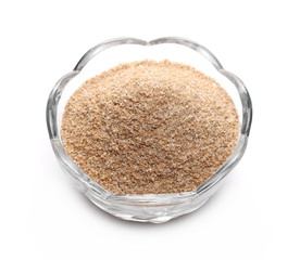 Spelt bran in glass bowl isolated on white background