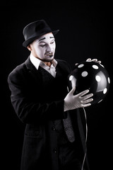 mime shows theatrical emotions on black background